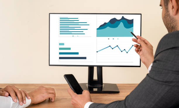 istock Close up photo of businessman using laptop and computer. 1427617435