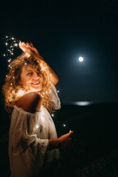istock Young woman with illumination light 1427618099