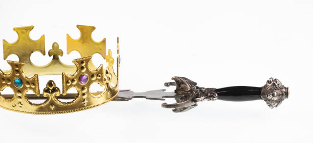 istock crown and knight sword isolated on white background 1427618144