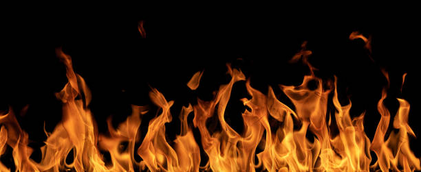 istock orange stripe of fire on black 1427618193