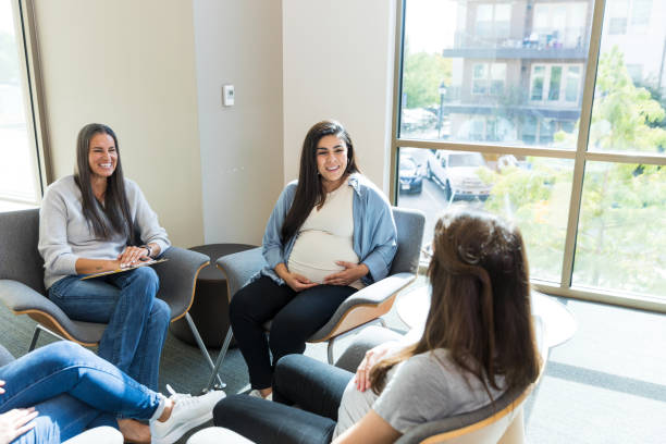 istock Unrecognizable expectant mom shares in group therapy 1427619460