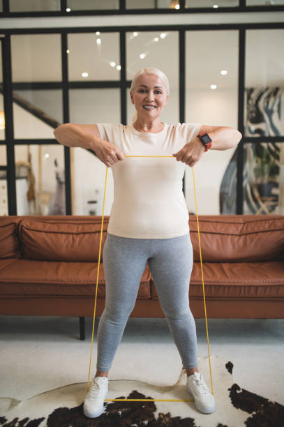 istock Pleased lady performing an upper body exercise 1427623221