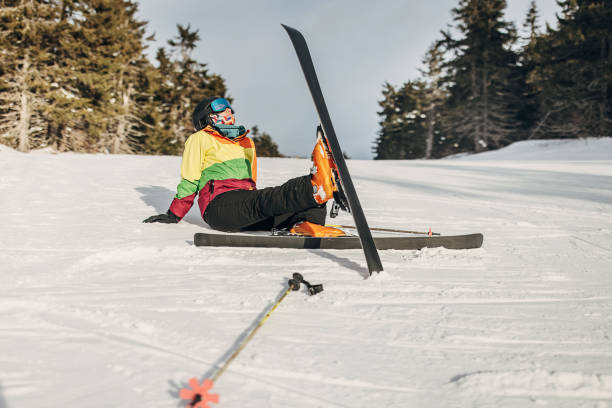 istock Woman fell down skiing on mountain 1427627875