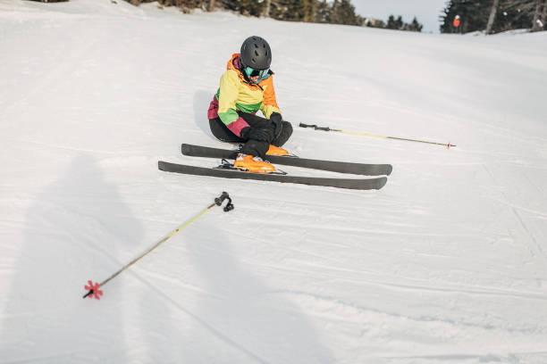 istock Woman fell down skiing on mountain 1427627898