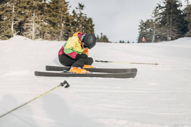 istock Woman fell down skiing on mountain 1427627961