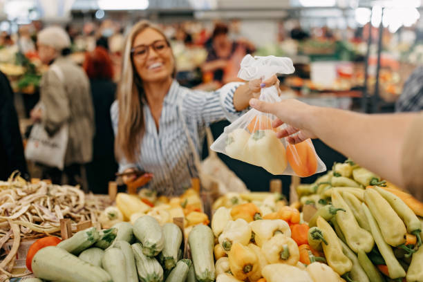 istock A hand taking a bag of vegetables 1427634250