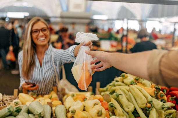 istock A hand taking a bag of vegetables 1427634291