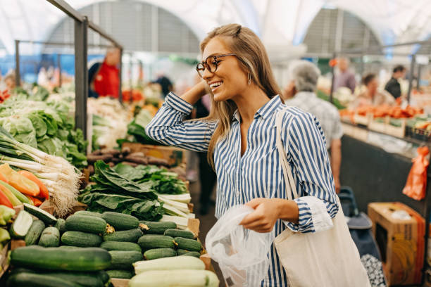 istock A woman at a vegetable stand 1427634372