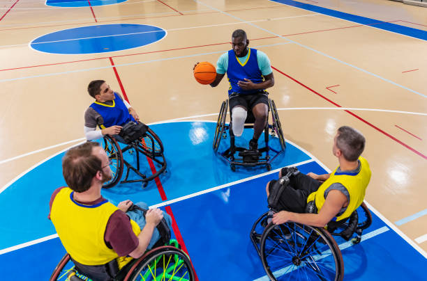 istock Wheelchair basketball team practicing in gym 1427635831