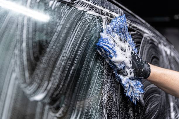 istock car wash employee thoroughly washes a modern ca 1427639035