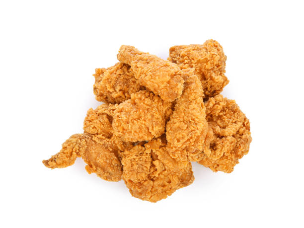 istock Heap of fried chicken isolated on white 1427649724