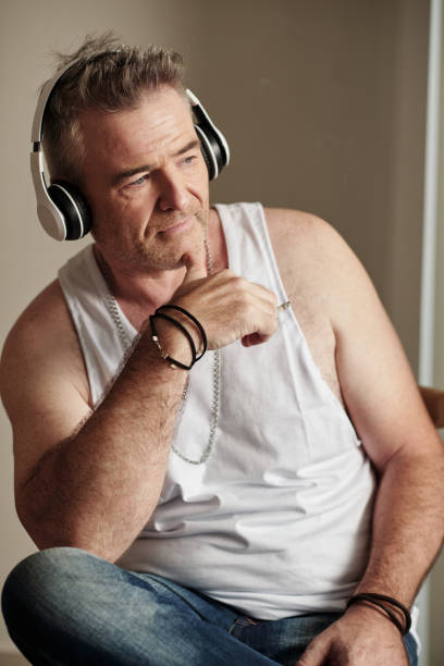 istock Mature Man Listening to Music 1427650107