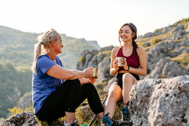 istock Mother And Daughter Drinking Coffee On The Mountain After A Hike 1427651775