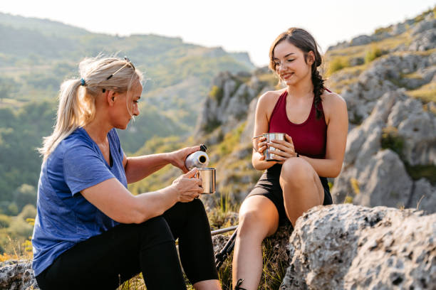 istock Mother And Daughter Drinking Coffee On The Mountain After A Hike 1427651817