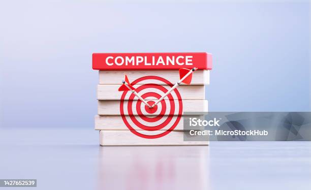 Compliance Concept Arrows Hitting Bulls Eye Target Symbol And The Compliance Word Written Wood Blocks In Front Defocused Background Stock Photo - Download Image Now