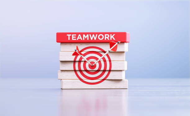 istock Teamwork Concept - Arrows Hitting Bull's Eye Target Symbol And The Teamwork Word Written Wood Blocks In Front Defocused Background 1427653549