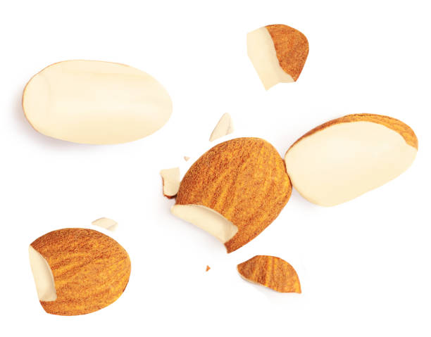 istock Group of almonds isolated on white background. Almond nuts pieces top view. Flat lay. Creative layout 1427653574