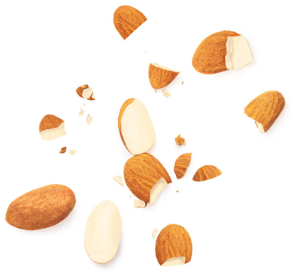 istock Group of almonds isolated on white background. Almond s nuts pieces top view. Flat lay. Creative food layout 1427653579
