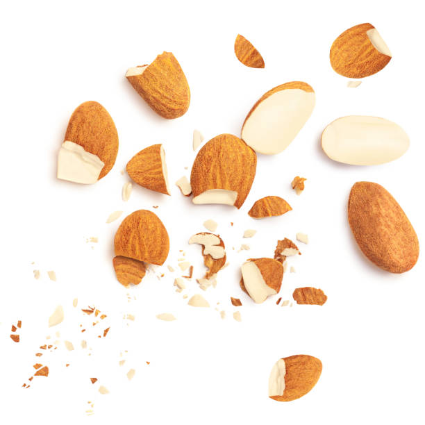 istock Group of almonds isolated on white background. Almond s nuts pieces top view. Flat lay. 1427653591
