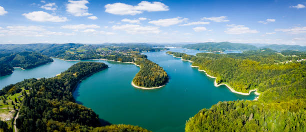 Vacations in Poland - view of Lake Solina and the spa village of Polanczyk in Bieszczady Mountains, waterdam in background