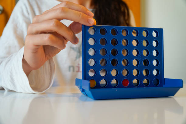 istock leisure and fun free time. Person plays board game. 1427655949