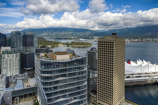 Vancouver, Canada - Circa 2021 : Downtown Vancouver with snowy mountain background