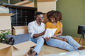 istock Young couple holding documents for new apartment 1427656959