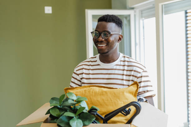 istock Young man moving into a new apartment 1427658090