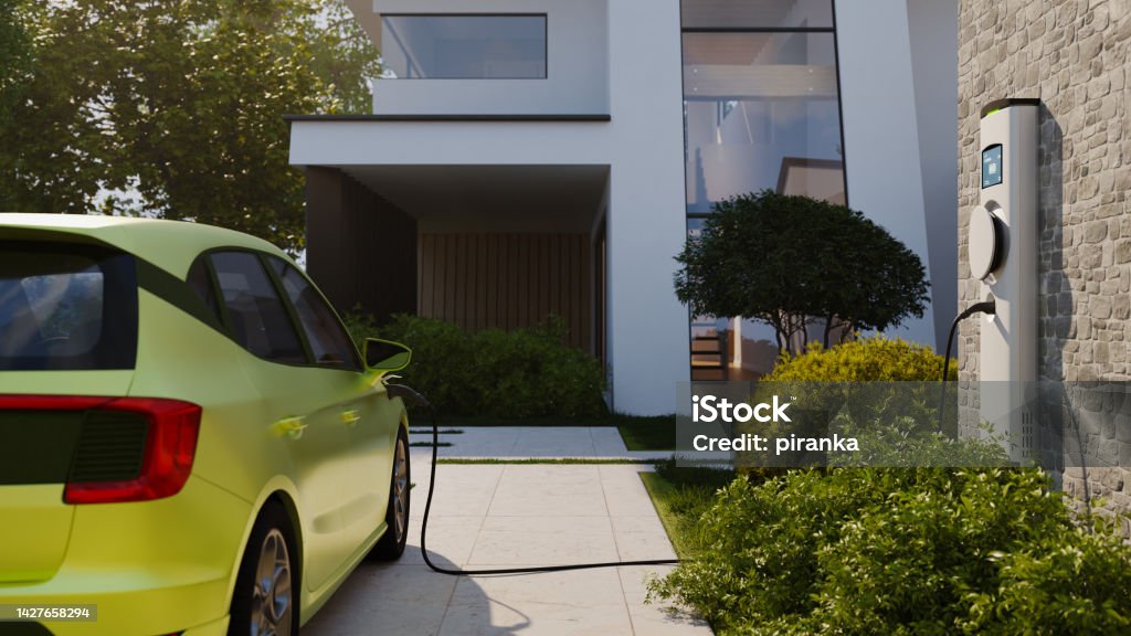 Electric vehicle charging An electric vehicle at a charging station in a modern home. All items in the scene are 3D, charging station and concept cars are not based on any real ones. Electric Vehicle Charging Station Stock Photo