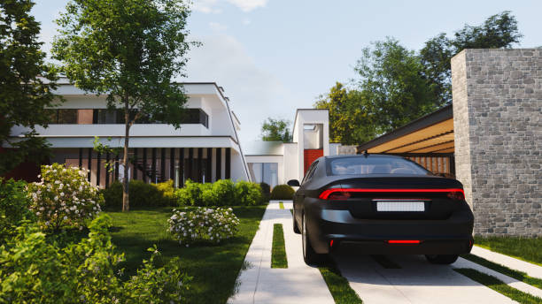 istock Car on modern house driveway 1427658599