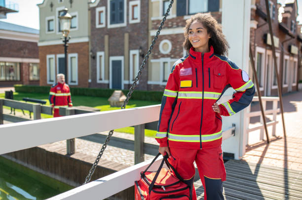 istock Joyful female paramedic standing on the stree 1427662437