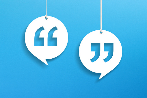 Speech Bubbles with Quotation Mark hanging on blue background