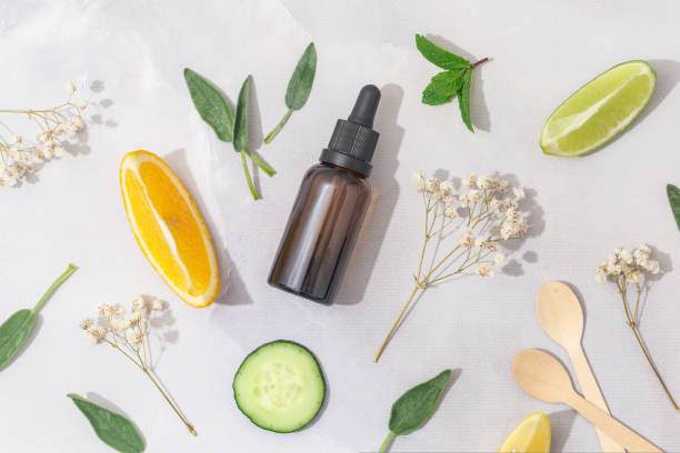 istock Flat lay composition with bottle of natural essential oil on white marble 1427666099
