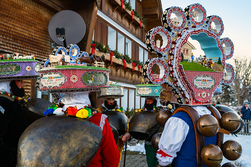 Urnasch, Switzerland - January 13, 2021: Silvesterchlausen or New Year Mummers (New Year's Eve Spirits) in traditional costumes celebrating New Year in Urnasch. Appenzell, Switzerland\nIts part of the Silvesterchlausen tradition of greeting for the New Year. Silvesterchlausen is a unique winter festival with pagan roots, celebrated in a few towns in the Canton of Appenzell. Its part of the Silvesterchlausen tradition of greeting for the New Year. Silvesterchlausen or New Year’s Mummer (Chlaus in Swiss German) is a masked person taking part in Saint Sylvester's Day festivities in Appenzell, Switzerland, and thus contributing to maintain the Chlausen tradition