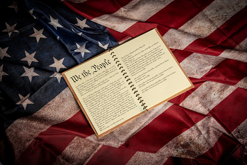 US Bill of Rights and Flag with spot lighting