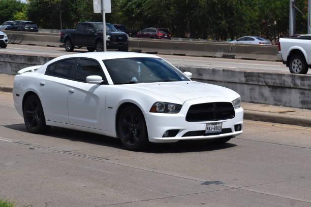 White Dodge Charger on Gulf Freeway, Interstate 45 (1-45) in Houston, Tx Dodge cruising on I-45 in Houston, Texas 2022 dodge charger stock pictures, royalty-free photos & images
