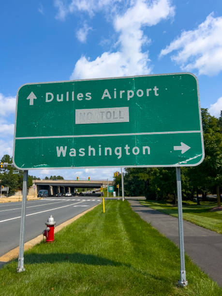 Dulles airport and Washington information sign next to the road. stock photo