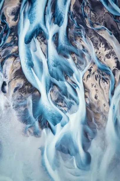 Aerial drone view of fantastic abstract Icelandic glacier rivers melting pattern in summer at highlands of Iceland