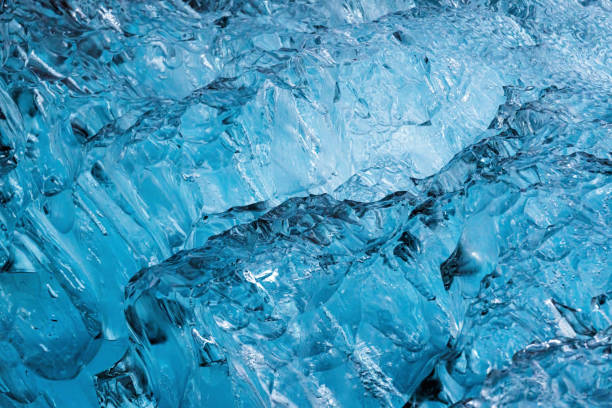 istock Abstract blue ice cracks from iceberg in glacier natural background 1427672568
