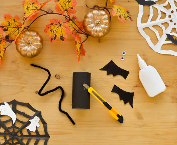 istock Step by step instruction. Step 2 Halloween decoration from toilet paper sleeve, handmade vampire bats, mummy, pumpkin. easy paper crafts for kids. 1427673795
