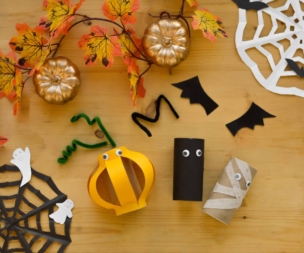 istock Step by step instruction. Step 4 Halloween decoration from toilet paper sleeve, handmade vampire bats, mummy, pumpkin. easy paper crafts for kids. 1427673900