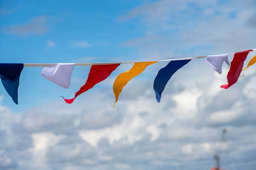 Colourful flags waving in a breeze