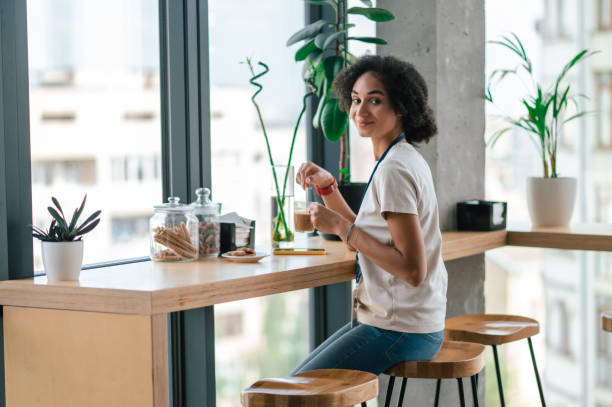 istock Young pretty office worker in the office canteen 1427678450