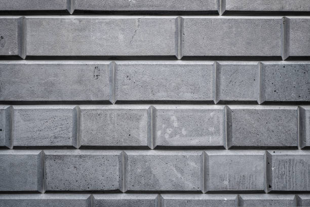 istock Gray, white bricks on the wall decoration for background. Stone brick wall textures. 1427682900