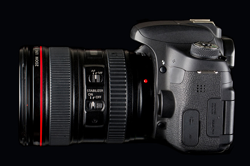 DSLR Camera and lens on black background