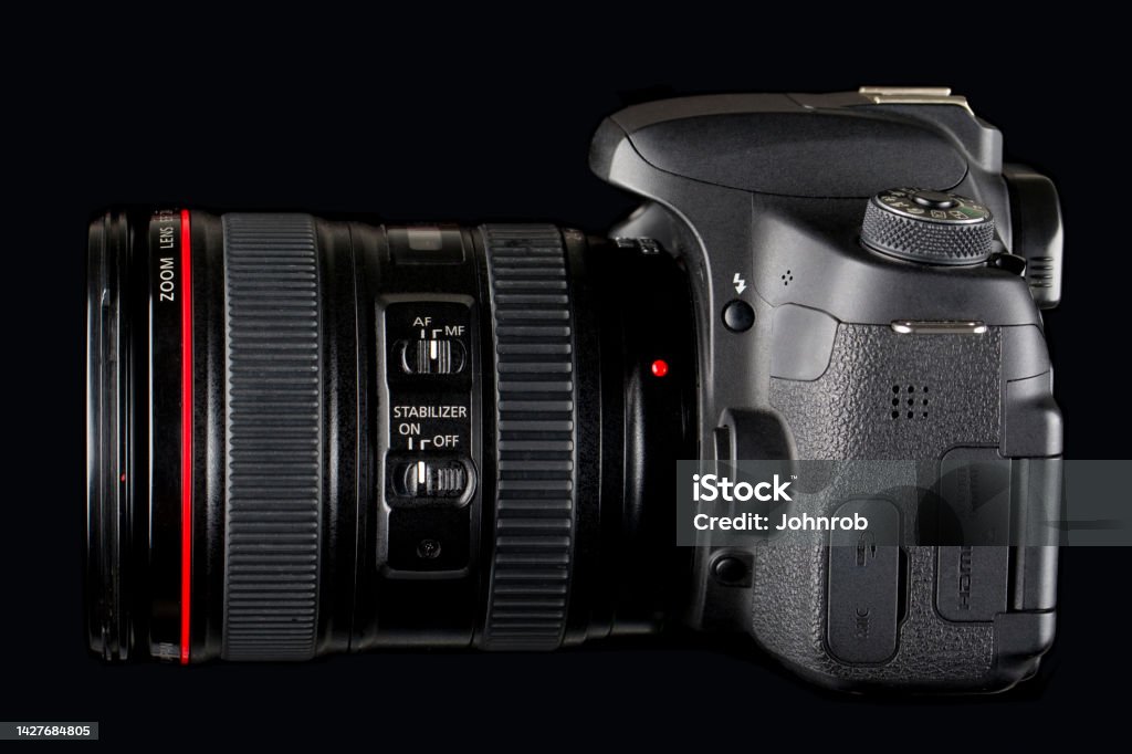 DSLR Camera side view on black background DSLR Camera and lens on black background Camera - Photographic Equipment Stock Photo