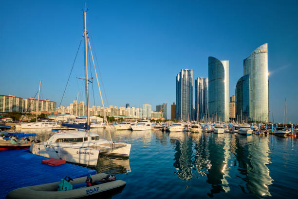BUSAN, SOUTH KOREA - APRIL 11, 2017: Busan marina with yachts, Marina city skyscrapers with reflection, South Korea