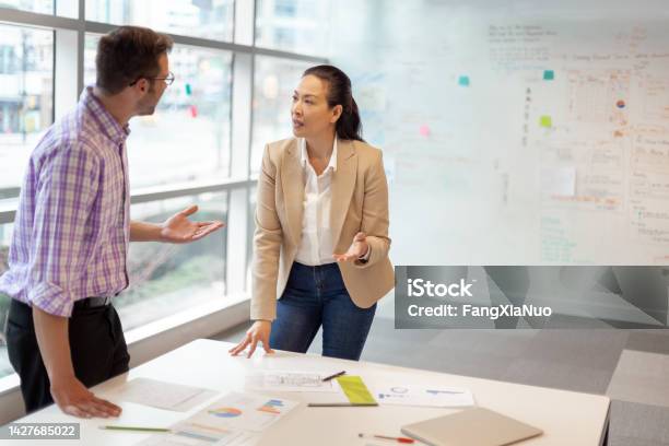 Multiracial Work Colleagues Having Meeting In Modern Business Office Stock Photo - Download Image Now