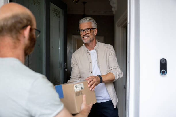 istock Man getting a package delivered to his house 1427686979