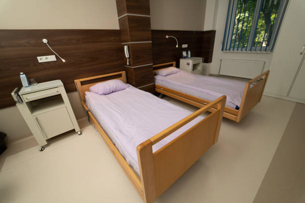 istock Medical ward with comfortable bed. Empty modern recovery room. 1427687271